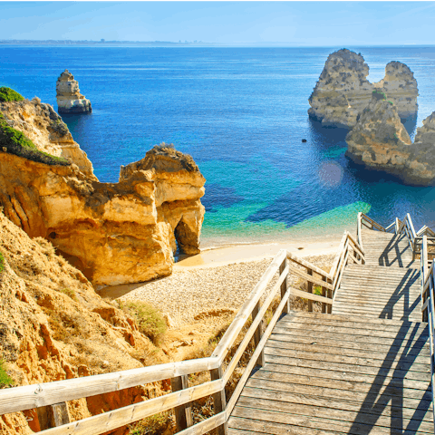 Feel the warm sand beneath your feet at nearby Castelo beach