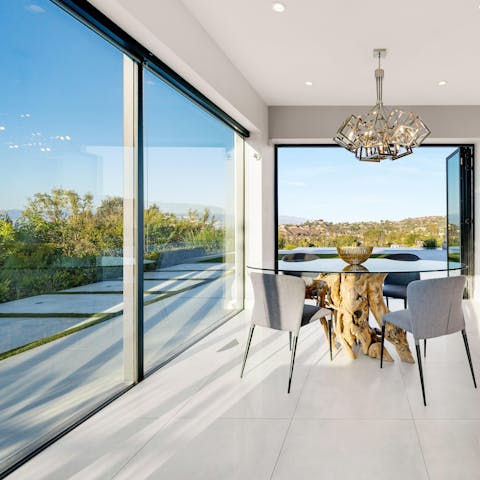 Soak up the panoramas from your glass-walled breakfast room, a coffee in hand