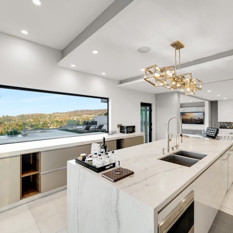 Prepare indulgent feasts for your loved ones in the slick, quartzite-topped kitchen