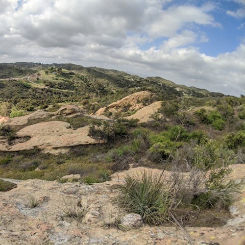 Hike the trails across Topanga for views across the San Fernando Valley,  the Marvin Braude Mulholland Gateway Park entrance is a ten-minute drive