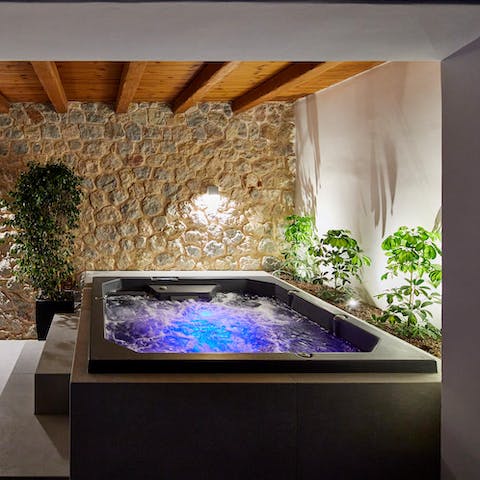 Sink into the hot tub for a late-night soak session overlooking the bay