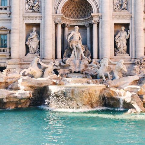 Visit the Trevi Fountain, a short walk away