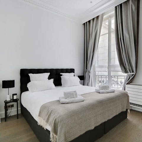 Wake up in the monochrome bedroom feeling rested and ready for another day of Paris sightseeing