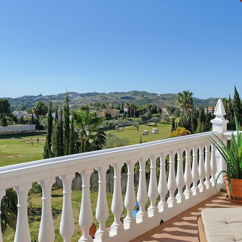 Take in the views over the golf course from the balcony