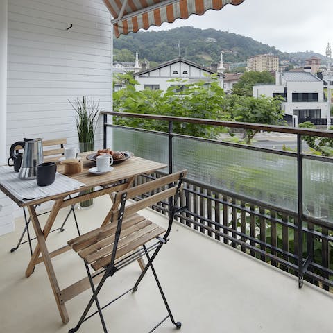 Sip a revitalising morning coffee on the private balcony