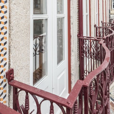 Open the French windows and peer over the ornate iron balconette