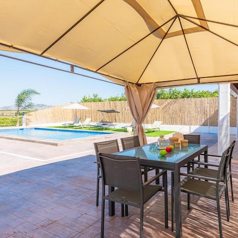 Share grilled barbecue dinners alfresco, under the shade of the pergola