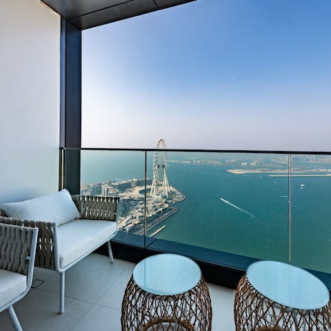 Wake up to panoramic views of the Persian Gulf and the Ain Dubai from your balcony