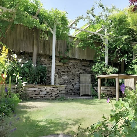 Admire the wisteria in the pretty garden
