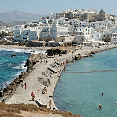 Explore the winding streets of Naxos Town – a 16 km drive away