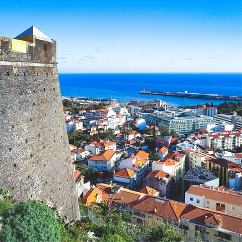 Explore Funchal's harbour, gardens and Madeira wine cellars