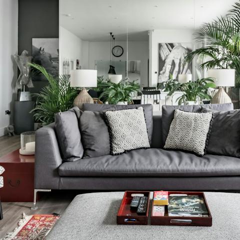 Get cosy in the living room, surrounded by house plants