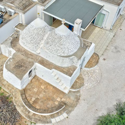 Stay in a Puglian home with a pair of the iconic trullo roofs
