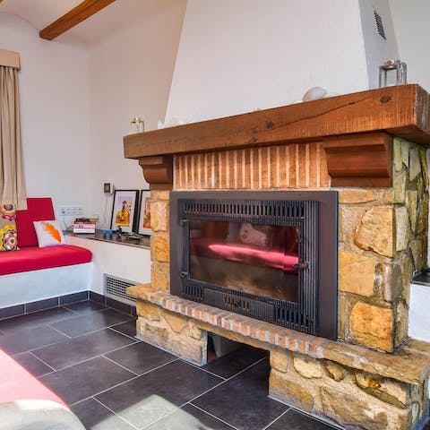 Cozy up by the fireplace on cooler nights