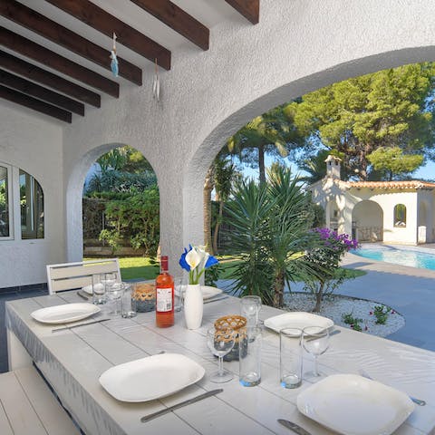 Take meals to the covered terrace area for alfresco dining