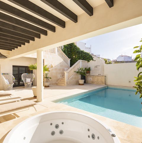 Take a dip in the pool or unwind in the Jacuzzi