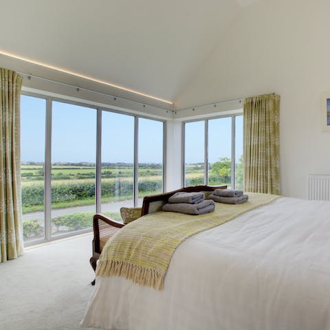 Wake up to expansive countryside views in the master bedroom