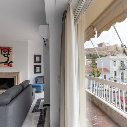 Take a cup of coffee onto the balcony to enjoy views of the Acropolis