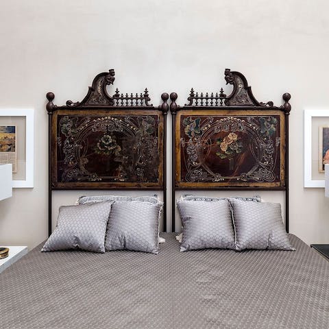 Get some rest in the master bedroom with its ornate, antique headboard