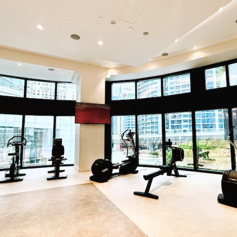 Maintain your weekly fitness plan in the building's on-site gym