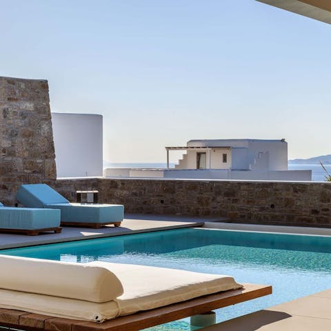 Lounge comfortably by the pool and enjoy those stunning sea views