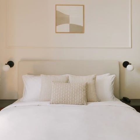 Wake up in the bed's crisp white sheets feeling rested and ready for another day of Milan exploring