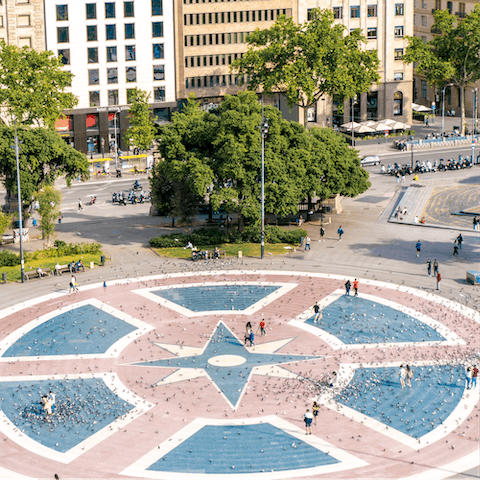 Stroll down to Plaça de Catalunya, known for its fountains and statues