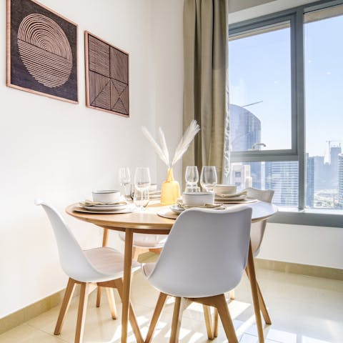 Dine by the window in the light-filled living space and admire impressive Dubai vistas