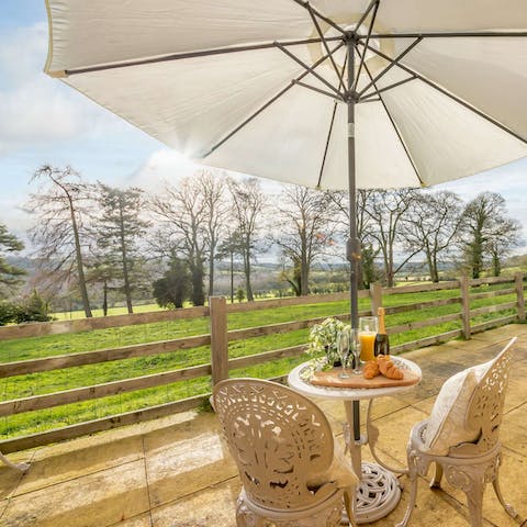 Enjoy your morning cup of coffee with a side of idyllic country views  on the patio