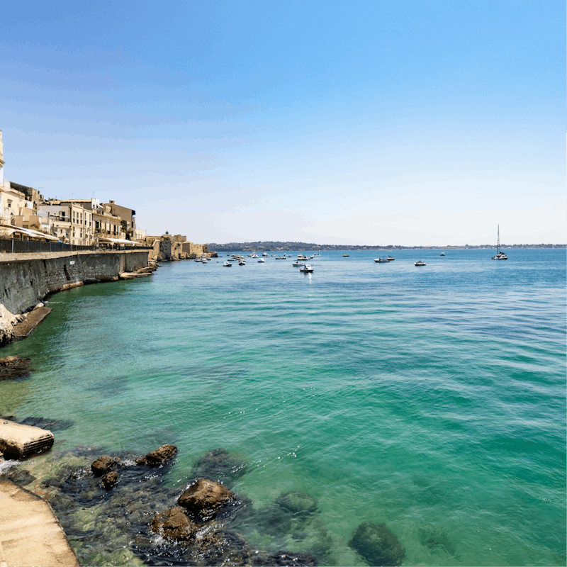 Take the short drive to the stunning clear waters of the Sicilian coast