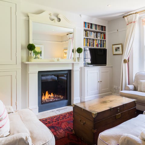 Cosy up in front of the fire in one of the living rooms