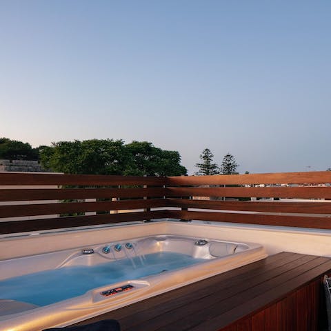 Slip into the private hot tub after a day exploring the old town