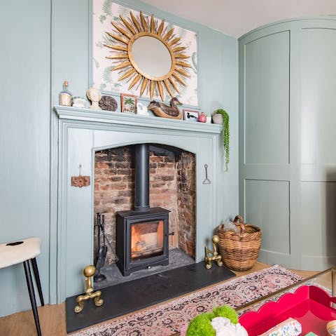 Relax on your plush sofa and get cosy beside the crackling fireplace