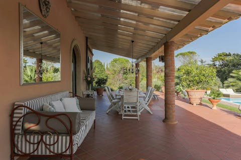 Relax with your holiday read on the shaded terrace