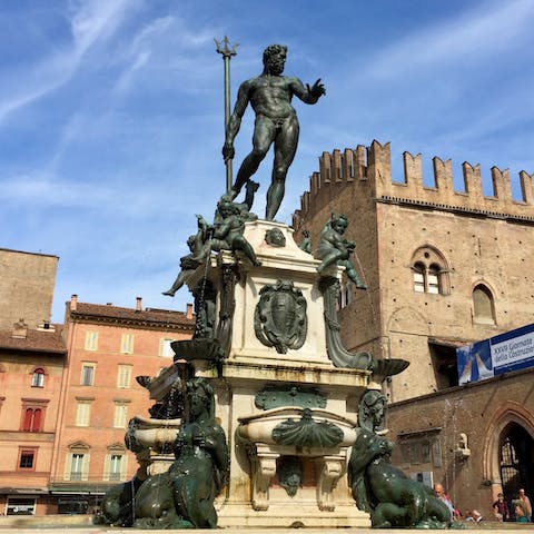 Visit the Fountain of Neptune, a seven-minute walk away