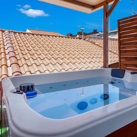 Relax in the private jacuzzi on a warm afternoon