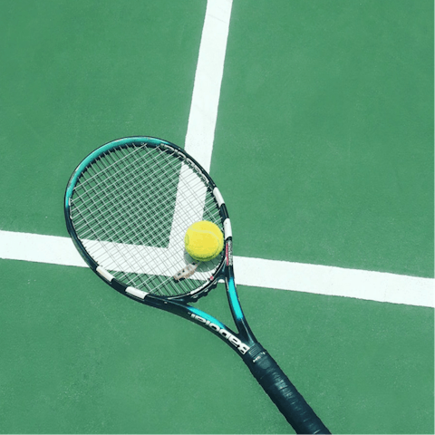 Play a few rounds of tennis on the private court
