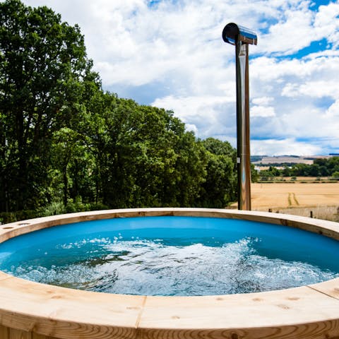 Relax and rejuvenate in the rustic wood-fired hot tub