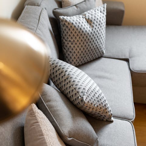 Spend a cosy evening on the plush sofa