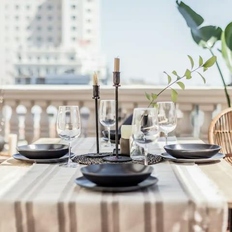 Dine alfresco as the city bustles with life below
