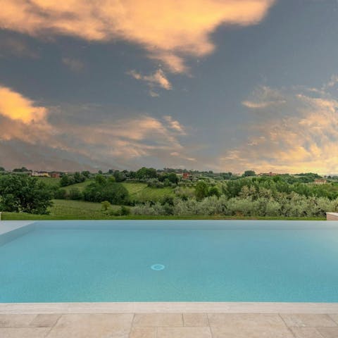 Admire the views of the Tuscan countryside from the private infinity pool