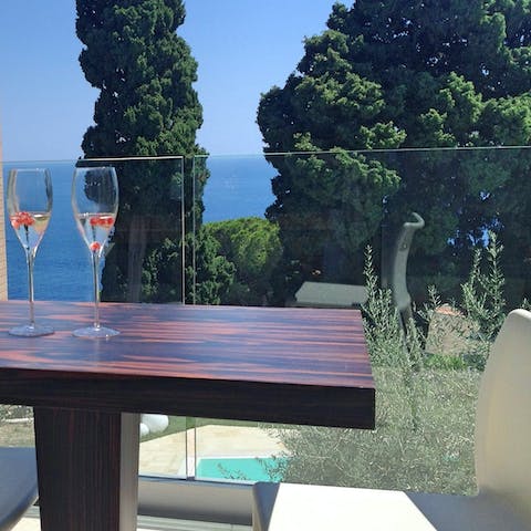 Admire the Mediterranean sea views with a glass of Sicillian rosé 