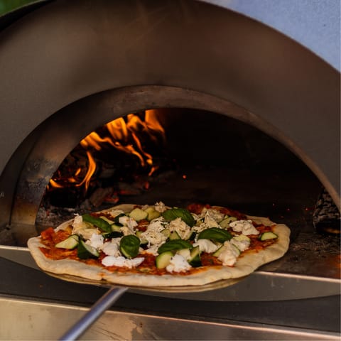 Cook a pizza in the outdoor oven or grill some local seafood on the barbecue