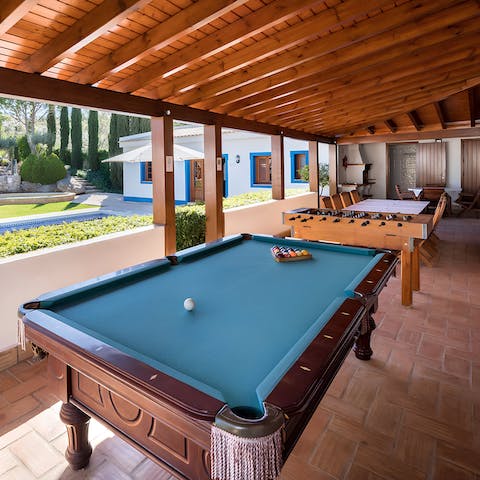 Challenge your loved ones to a few games of pool or table football on the covered terrace