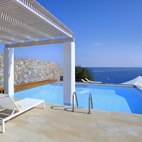 Gaze at the deep blue Aegean from the privacy of the pool terrace