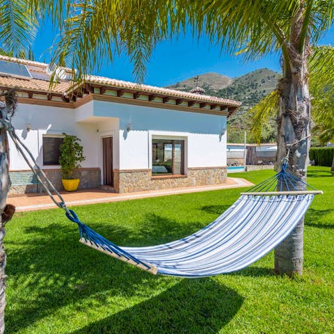 Lie back and soak up  the sun in the one of the hammocks