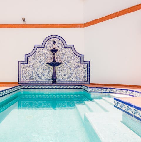 Cool off in the private swimming pool, complete with hand-painted tiles