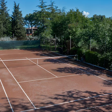 Serve up an ace on the private tennis court