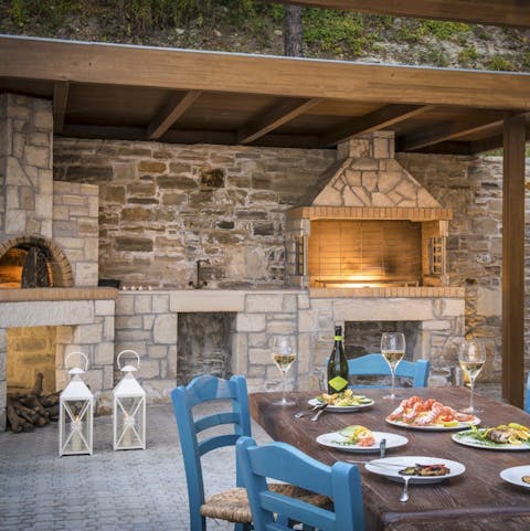 Embrace rustic Cretian cooking with the wood-fired grill and pizza oven outside