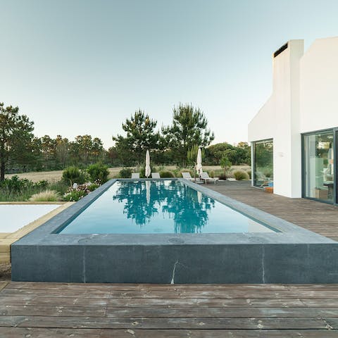 Spend lazy days relaxing by the pool, taking a dip to cool off from the mid-day sun